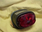 Harley,fl, FX,56-72, New Tail Light Assembly, Black Primer Oe # 68005-55A. Price: $49.99.